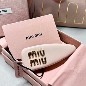 MIUMIU patent leather hair clip for women